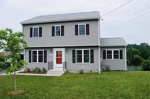 a front view of a house with a yard