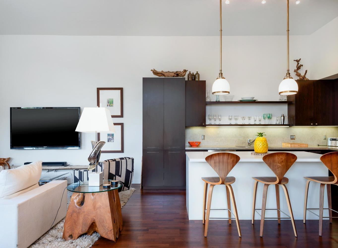 a living room with furniture and a flat screen tv