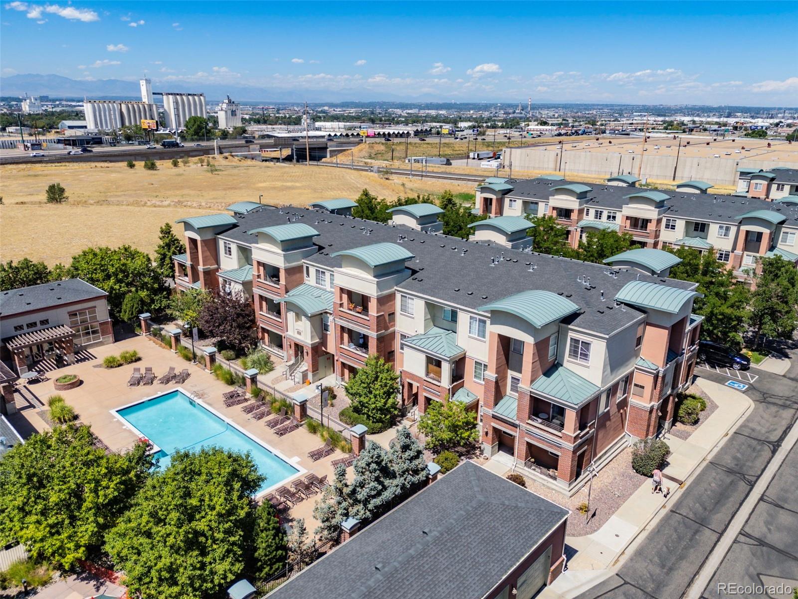 an aerial view of residential building with outdoor space and ocean view