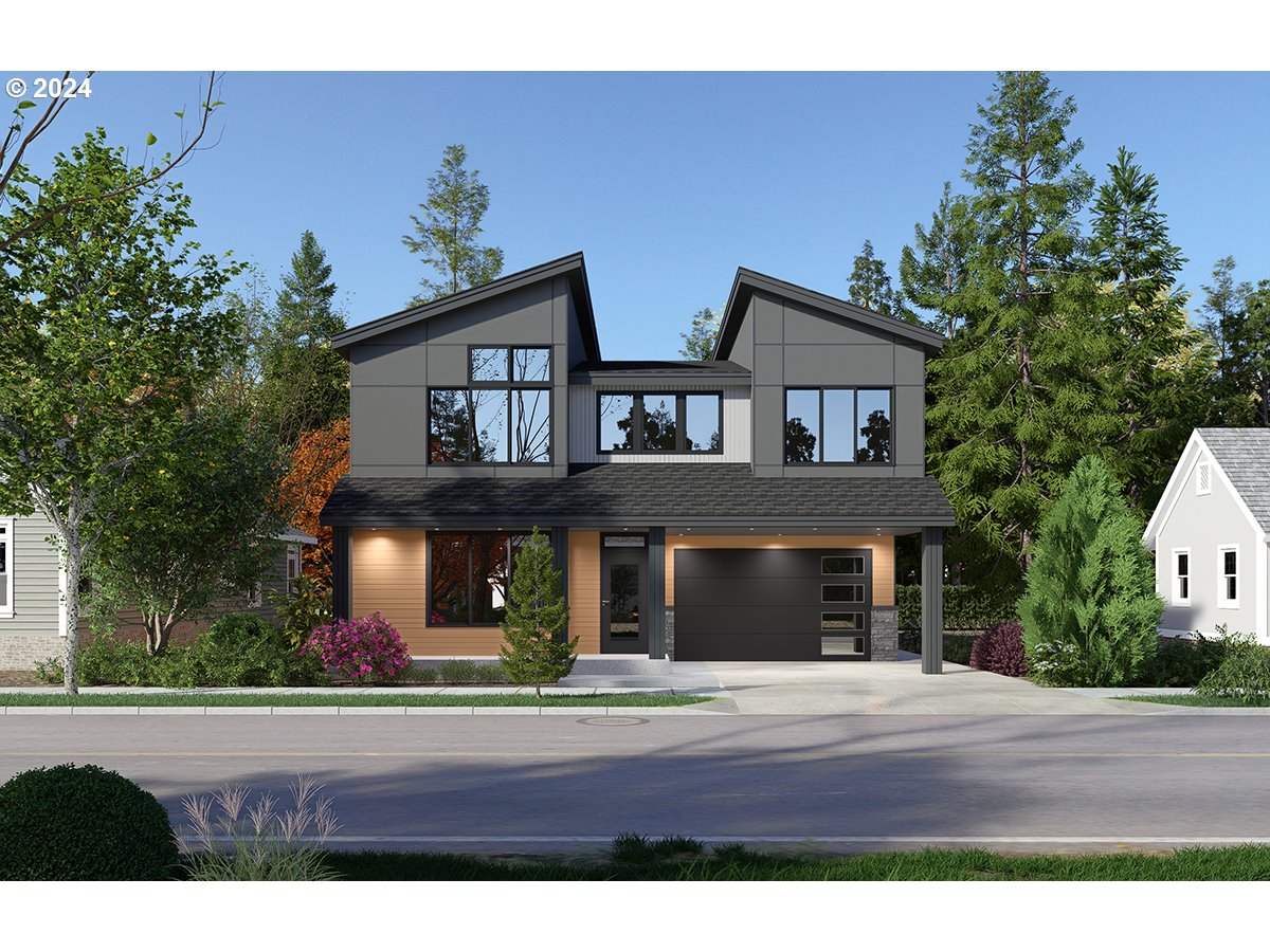 a front view of house with yard and trees in the background