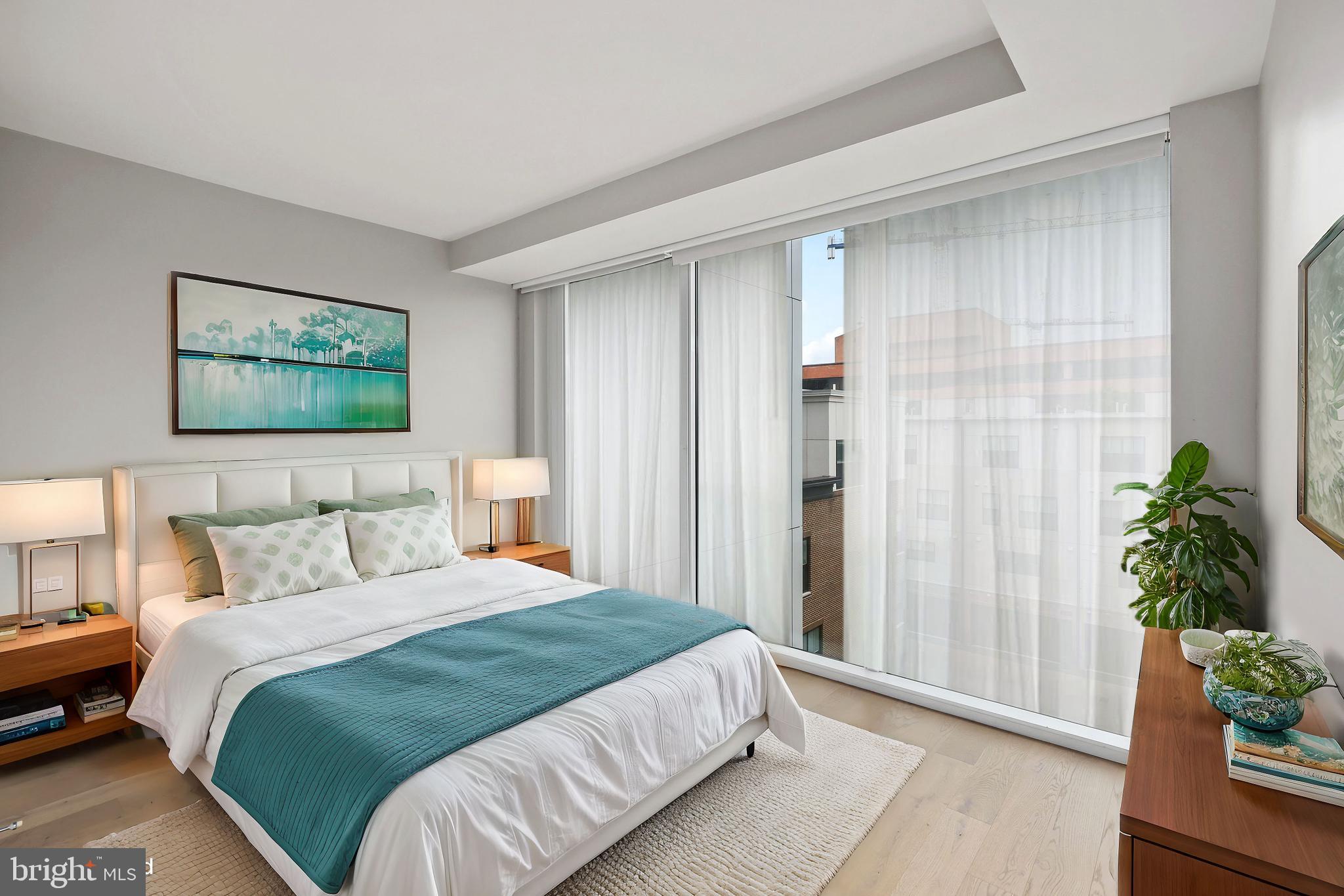 a bedroom with bed and a potted plant