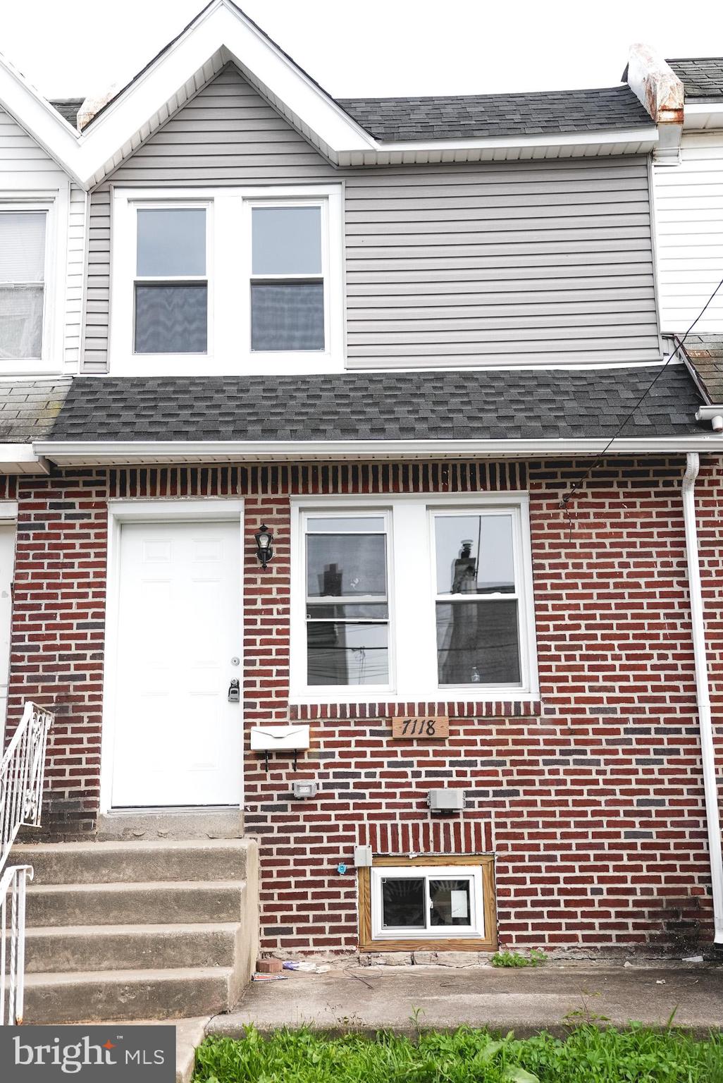 a brick house with a large windows