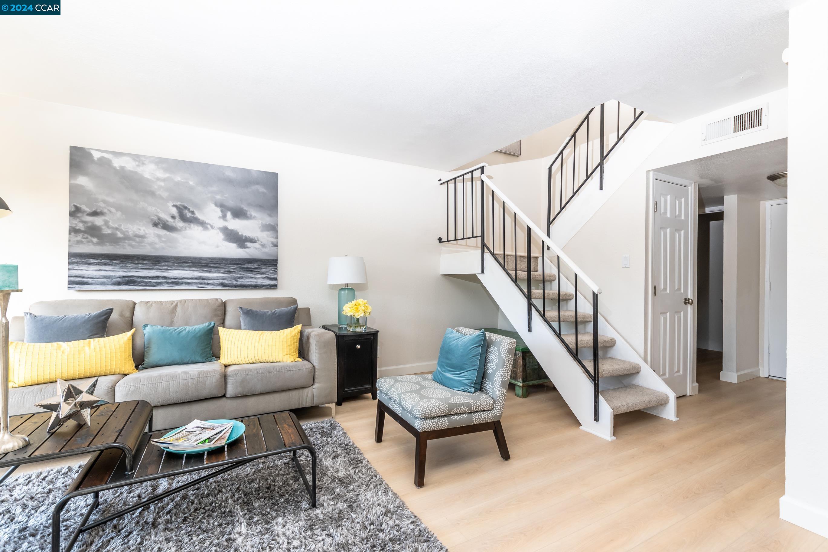 a living room with furniture and a rug