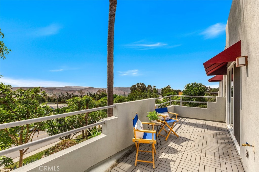 a view of roof deck with furniture