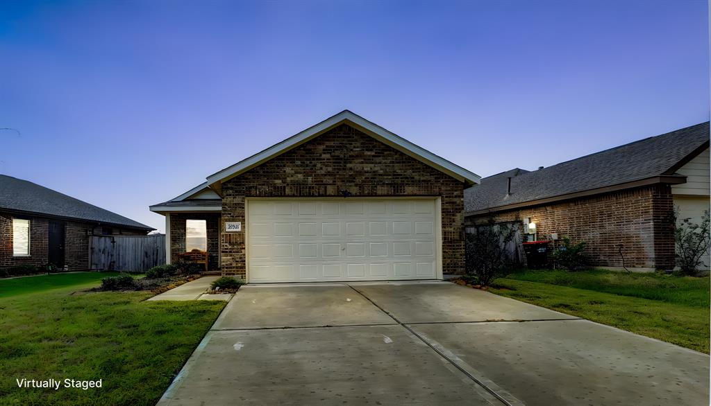 a front view of house with yard and green space