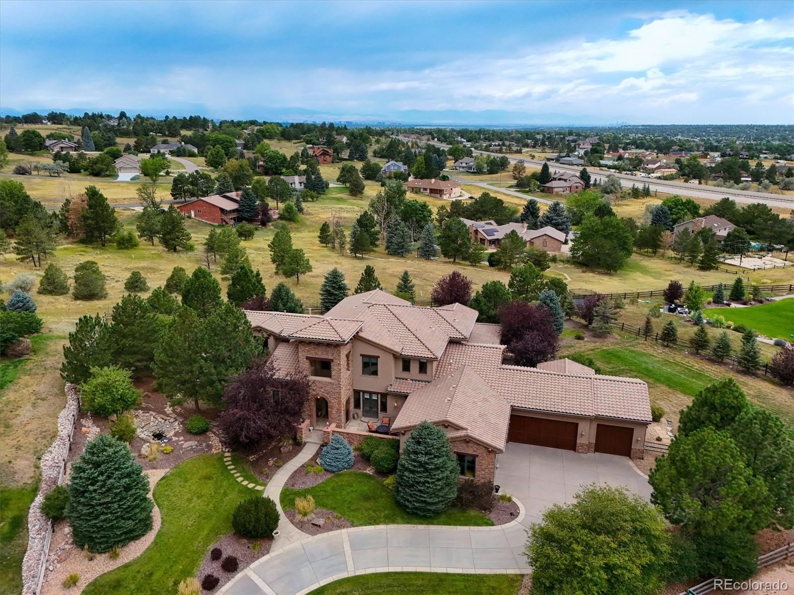 an aerial view of multiple houses with yard