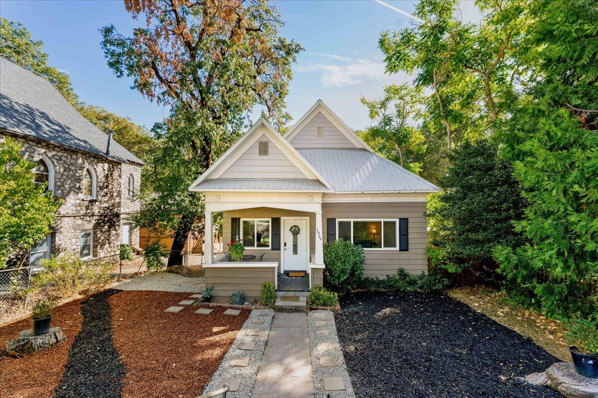 a front view of a house with garden