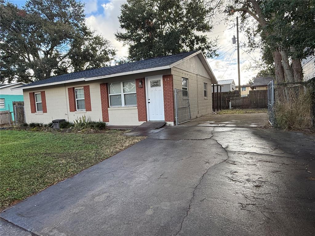 a view of a yard in front view of a house