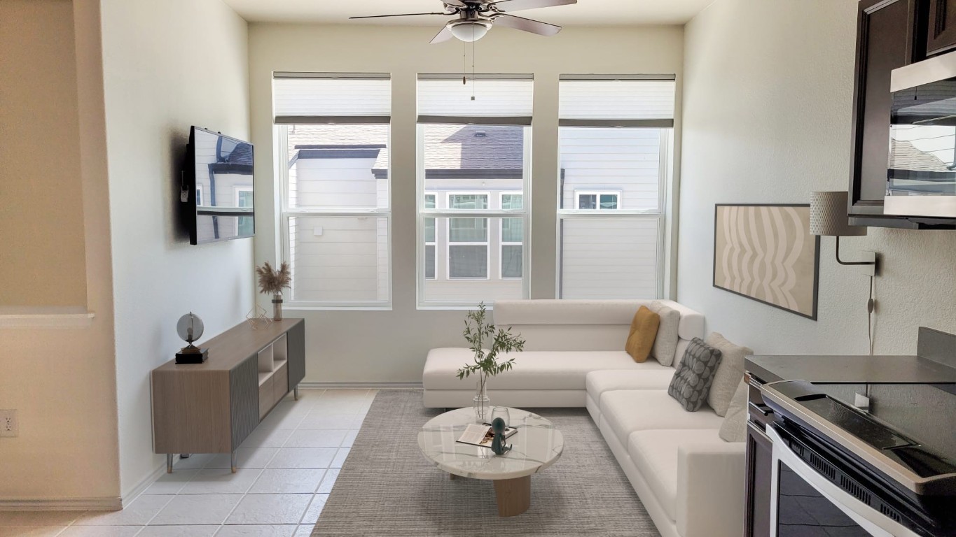 a living room with furniture and a large window