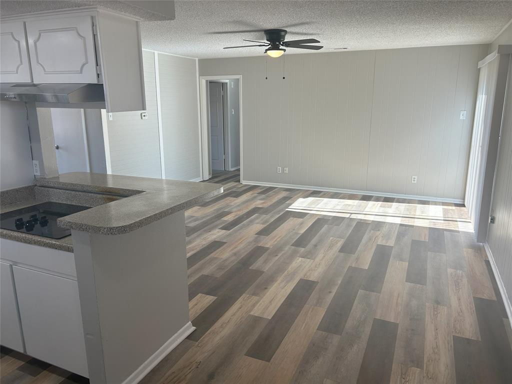 a view of a kitchen from the hallway