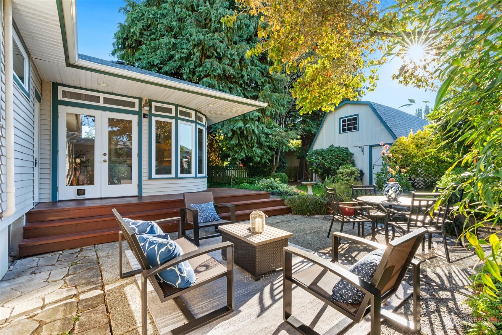 a view of backyard of house with seating area