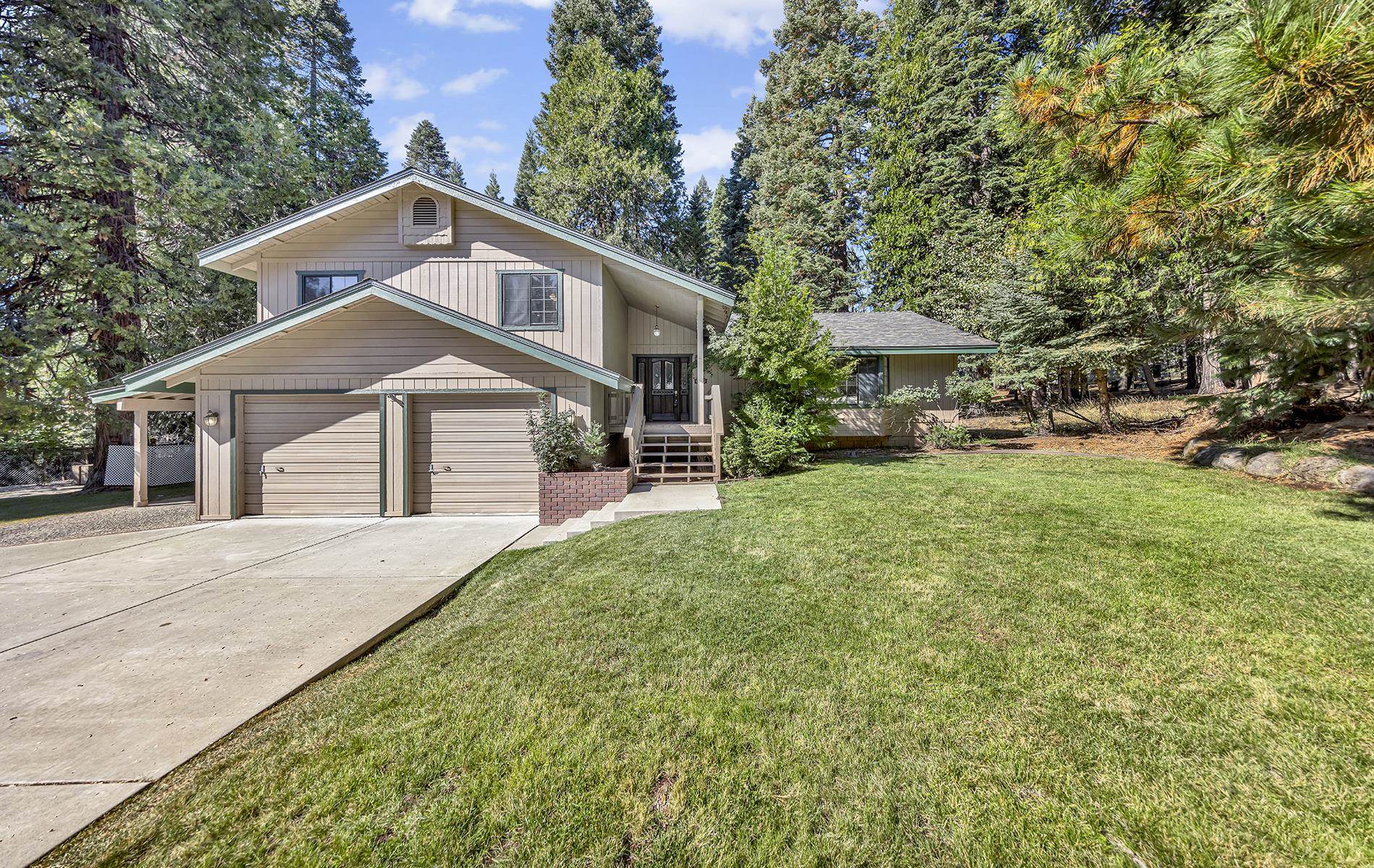 a front view of a house with a yard