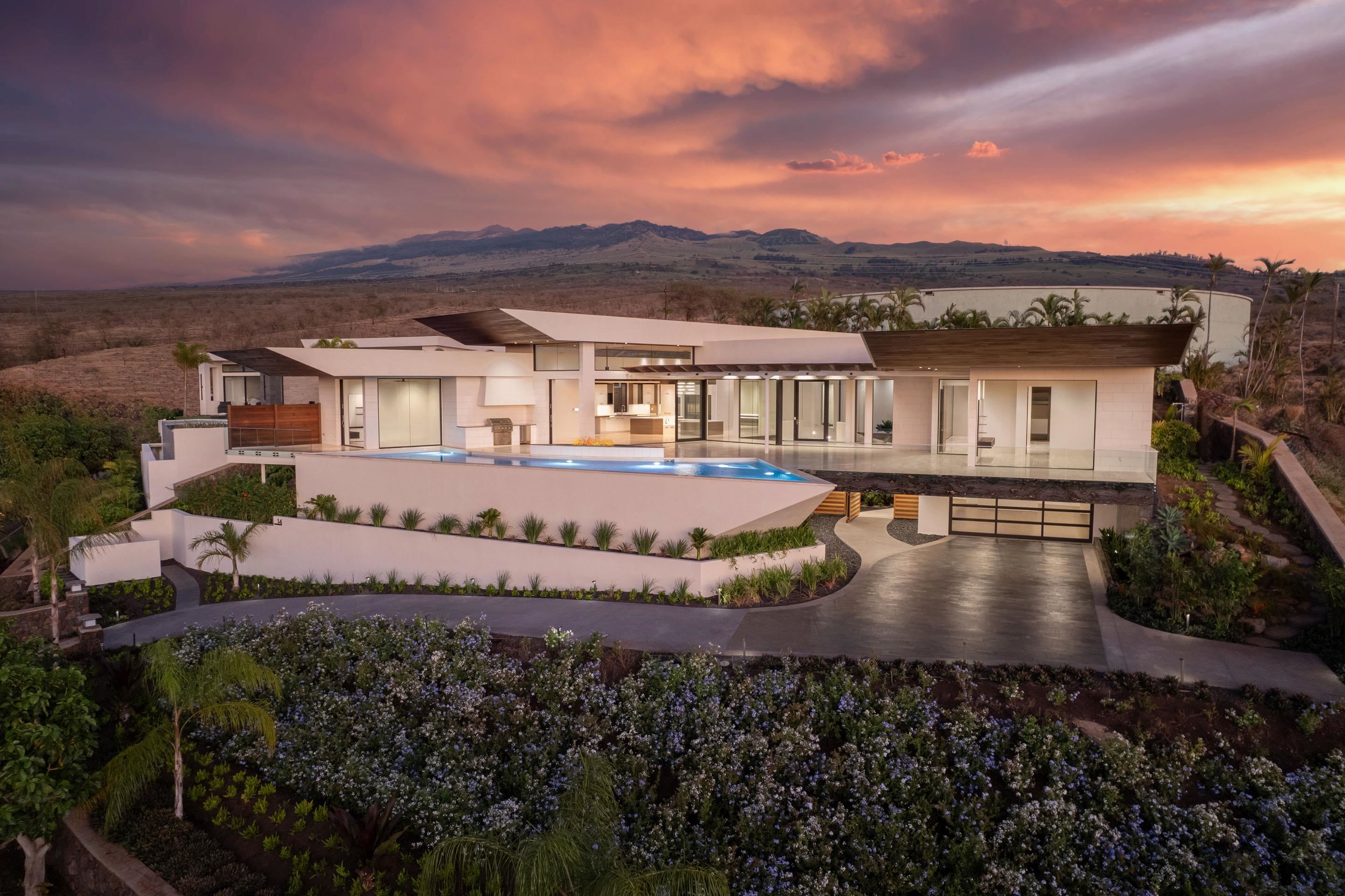 an aerial view of a house with a yard lake view and mountain view