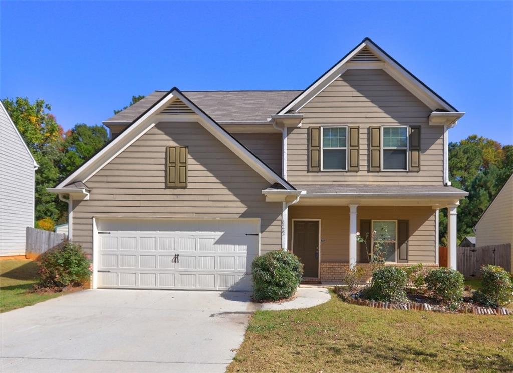 front view of a house with a yard