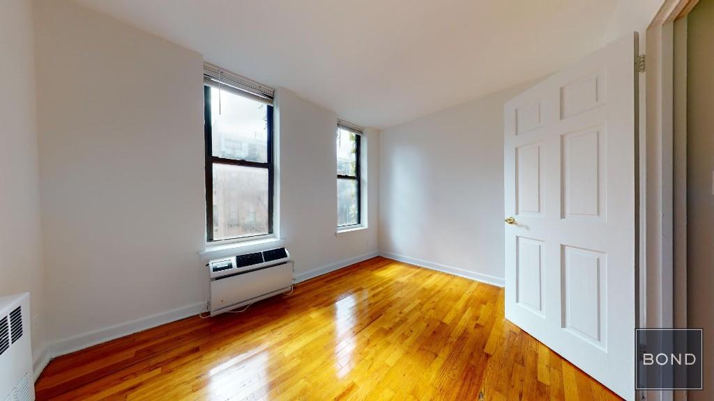 a view of a bedroom with window