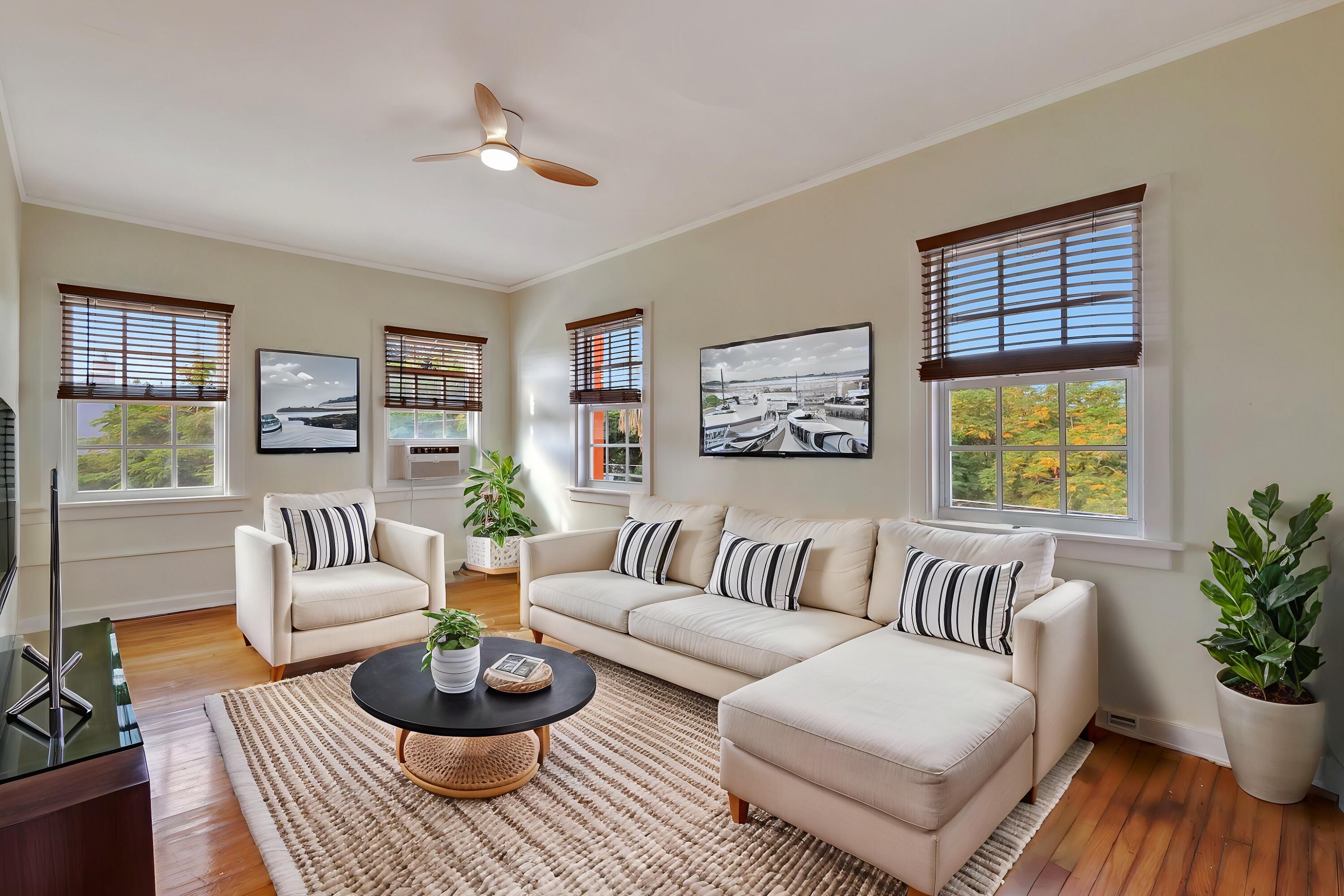 a living room with furniture and a large window