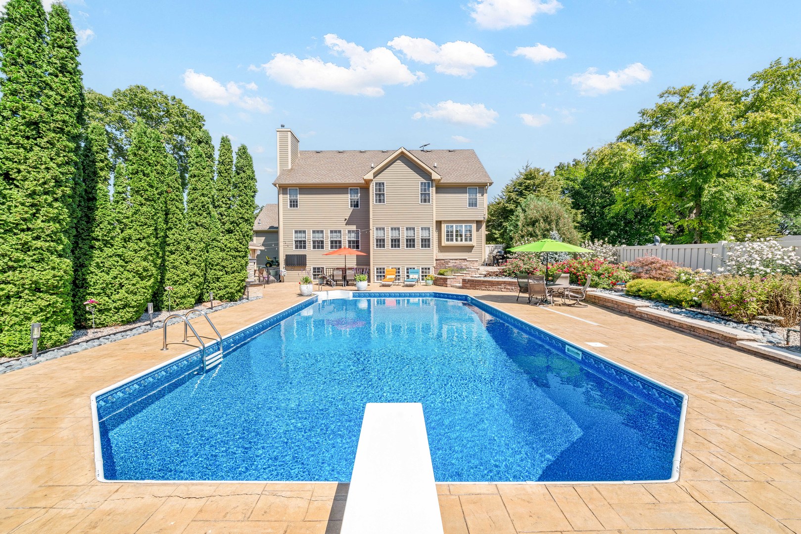 a view of a swimming pool with a lounge chairs