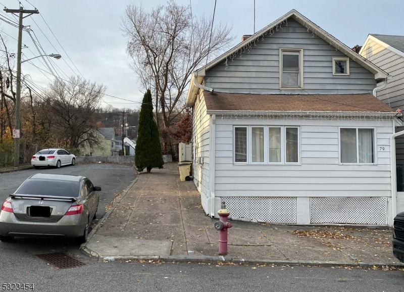 a view of a car parked in front of a house