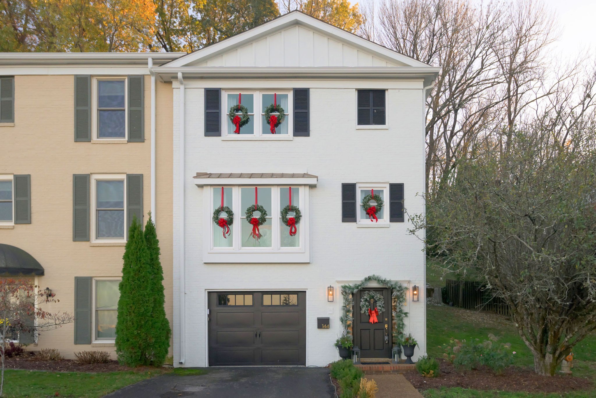 a front view of a house with garden