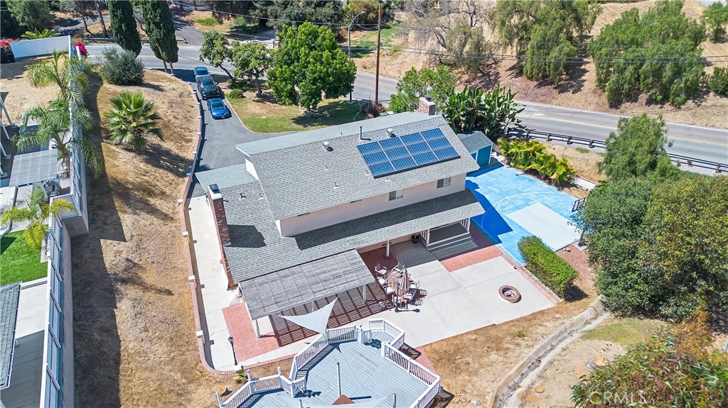 an aerial view of a house with a yard