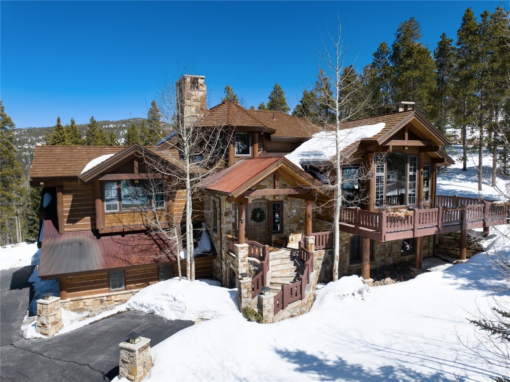 a view of a house with wooden deck