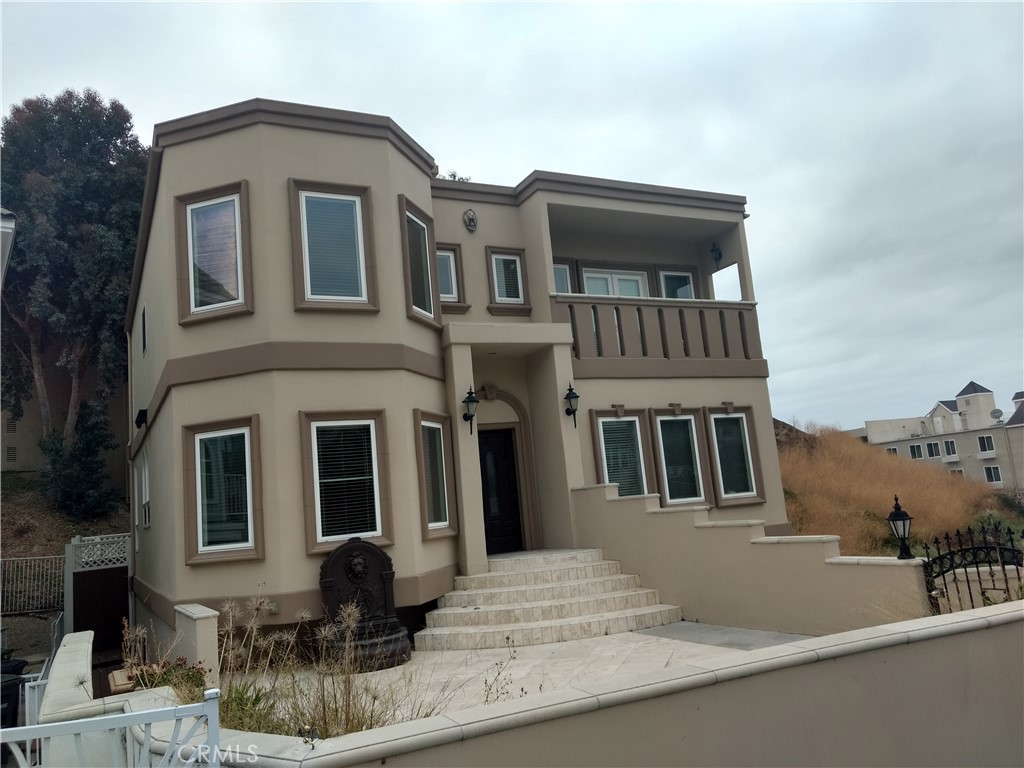 a front view of a house with balcony