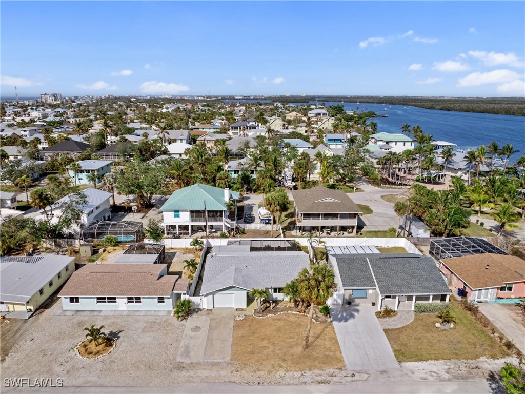 an aerial view of a house with a ocean view