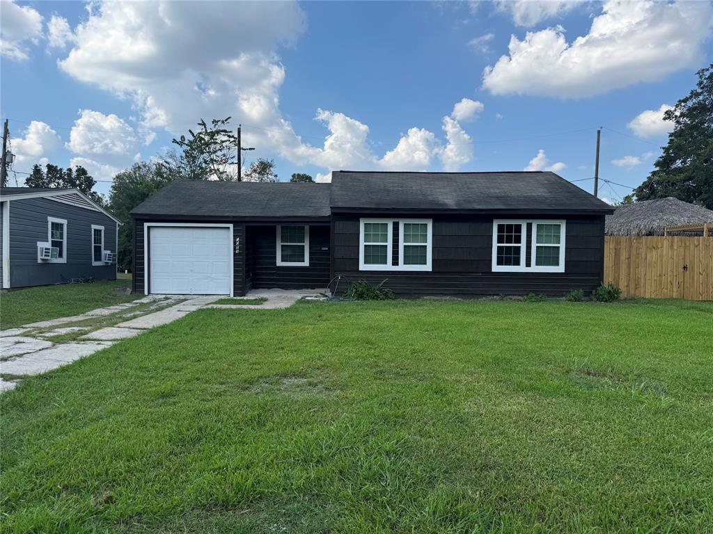 a view of a house with a backyard