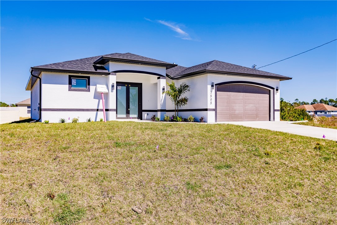 a front view of a house with a yard