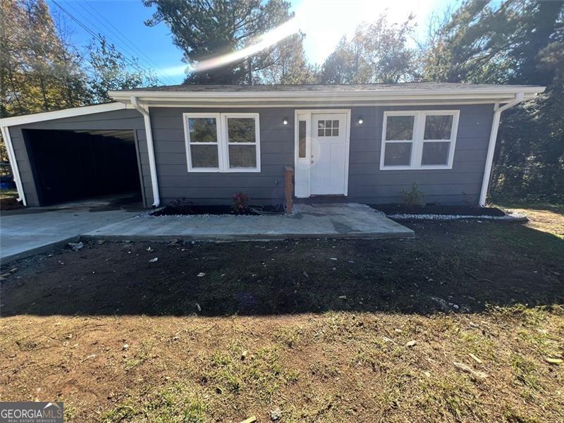 a view of house with yard