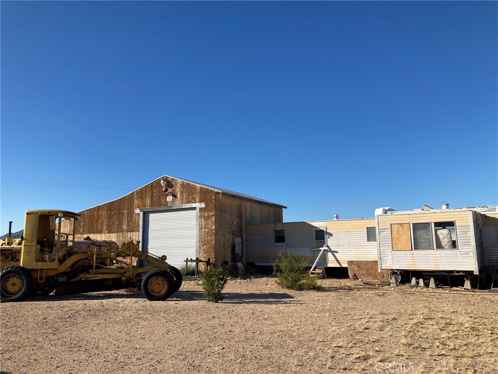 South side of the large building.  Mobile home is to the right.