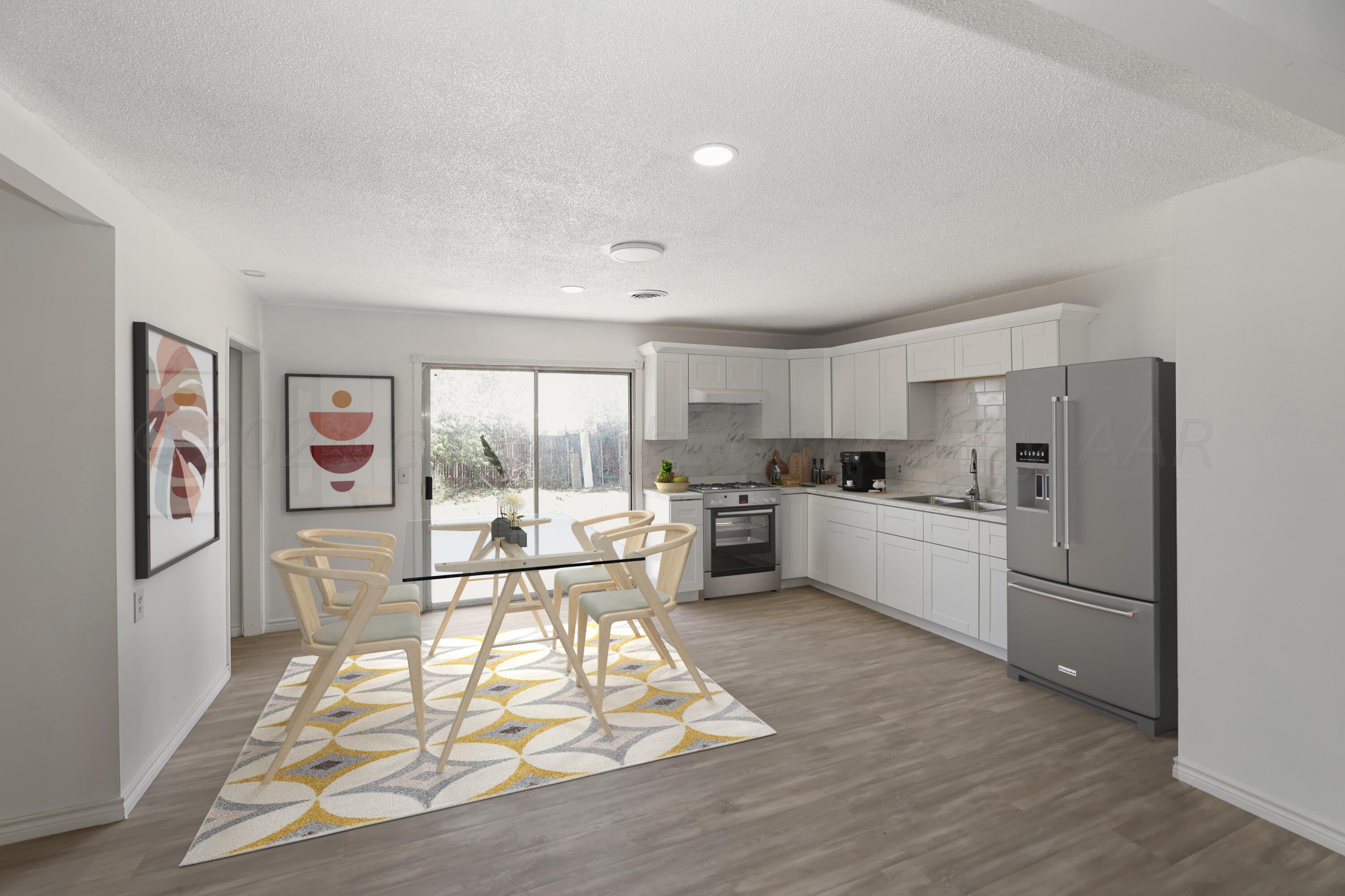 a living room with stainless steel appliances granite countertop a refrigerator and a stove top oven