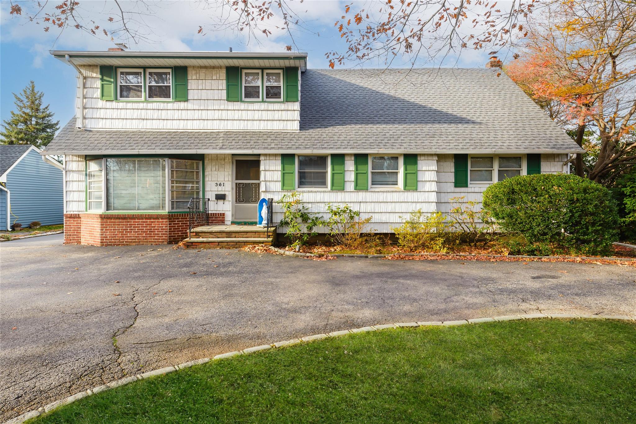 front view of a house with a yard