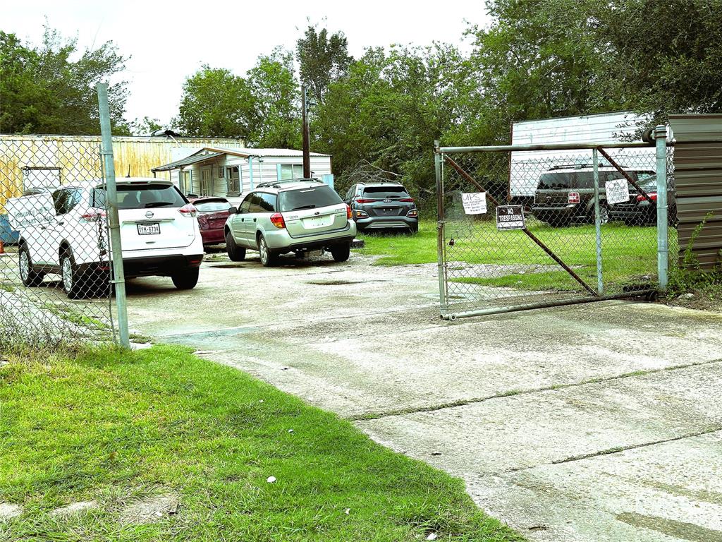 a view of a park with car parked