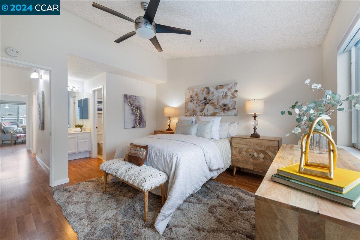 a bedroom with a bed and ceiling fan