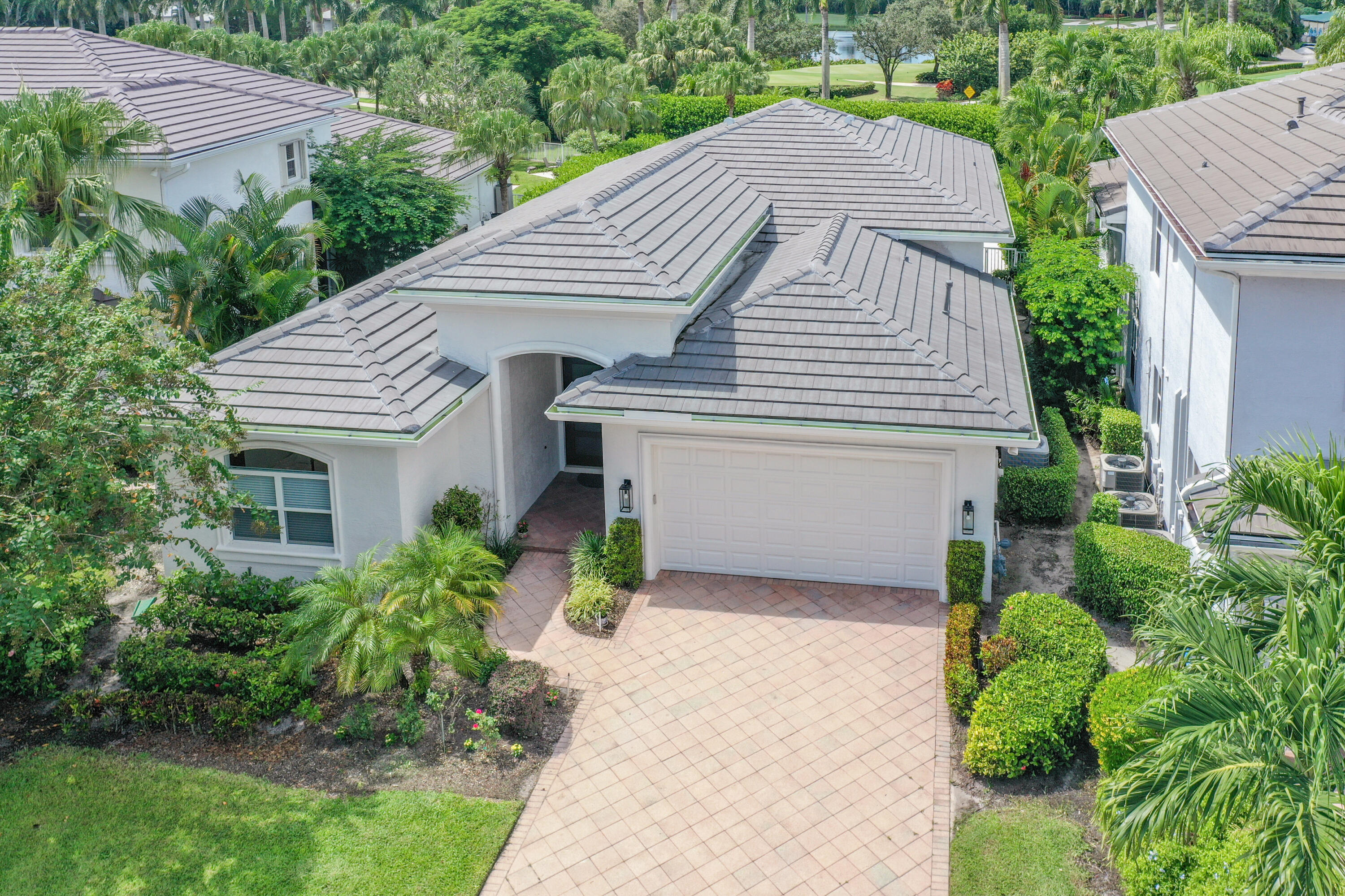 a aerial view of a house with a yard and plants