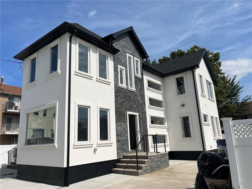 a front view of a house with glass windows