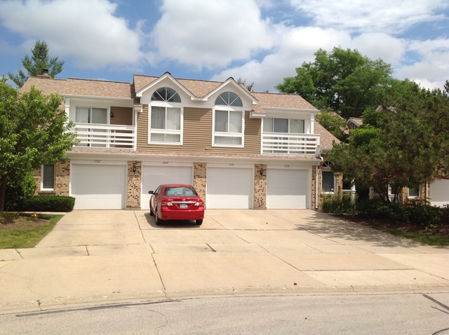 a front view of a house with a garage