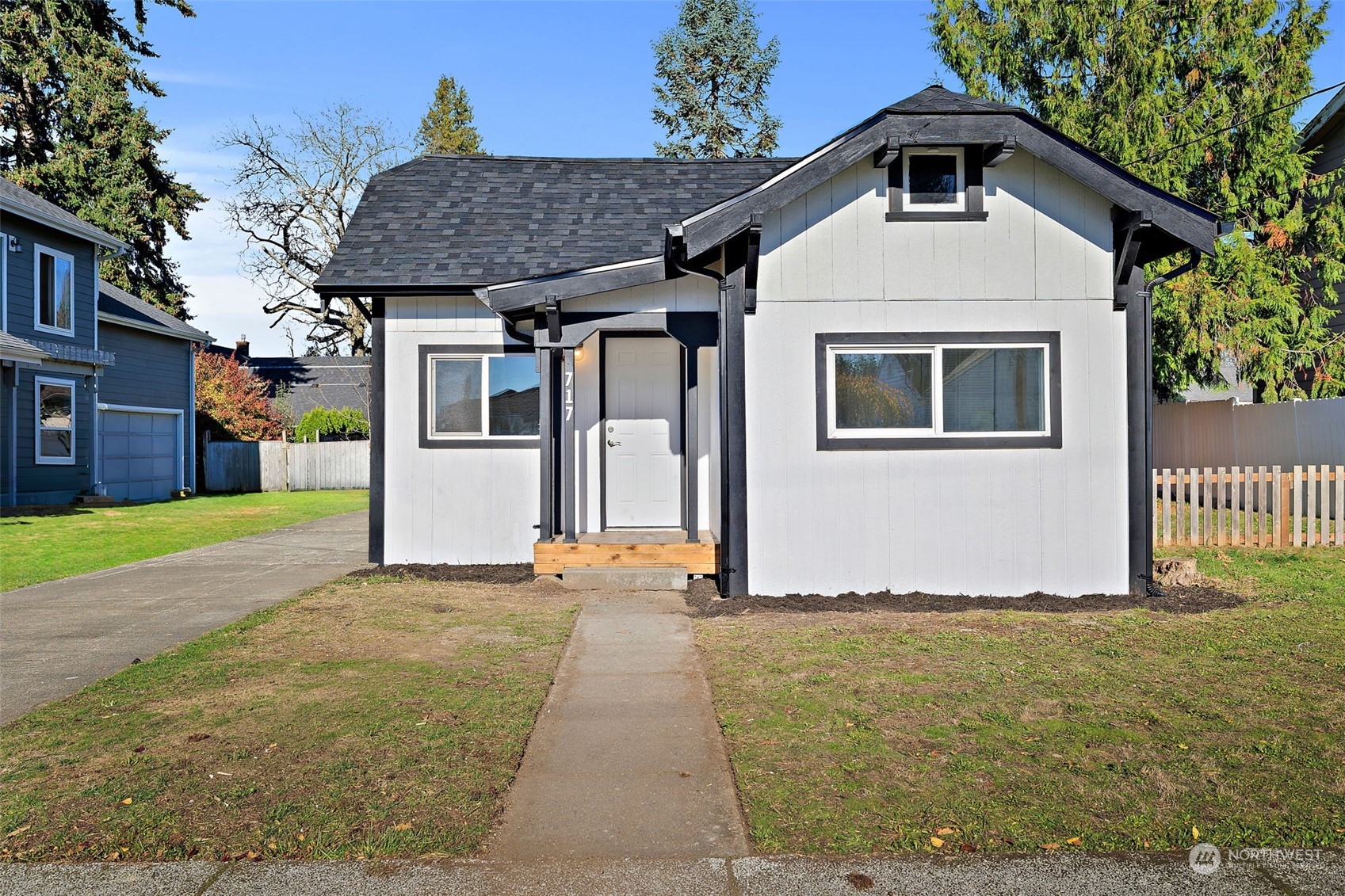 a front view of a house with a yard