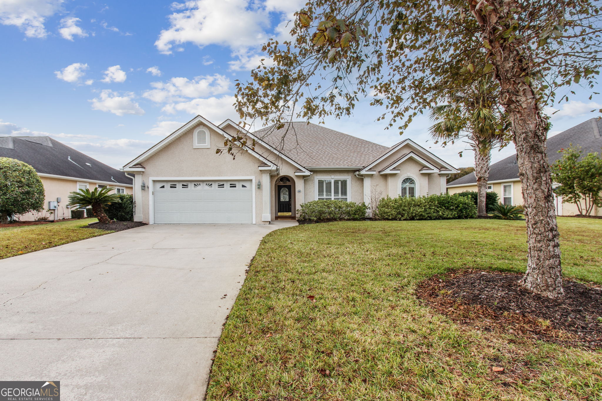 a front view of a house with a yard