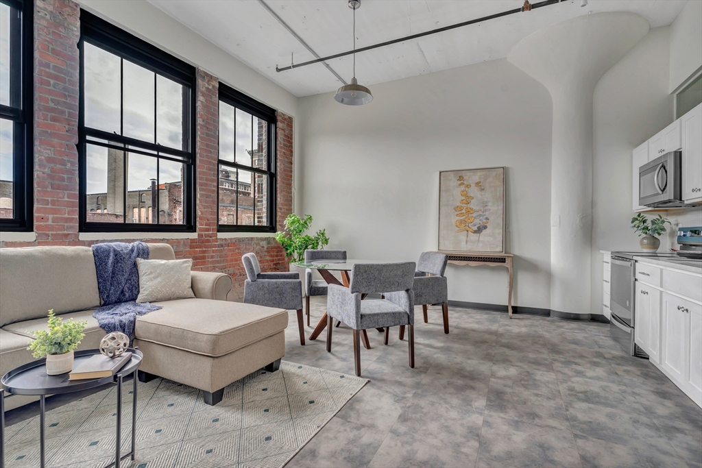 a living room with furniture and windows