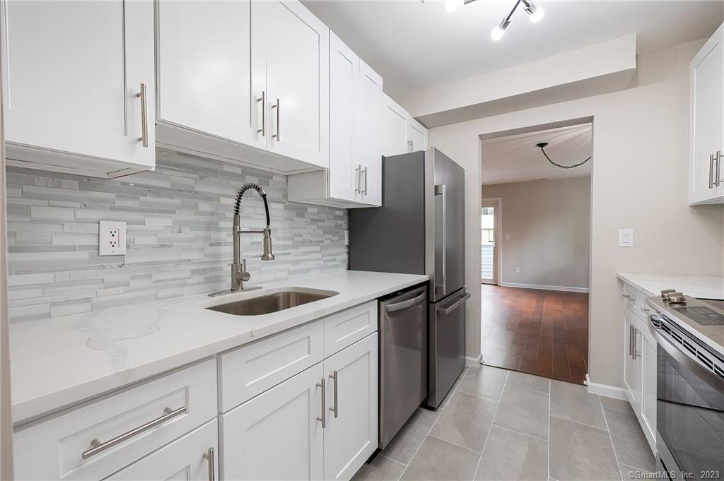 Kitchen leads into Dining Room and Living Room