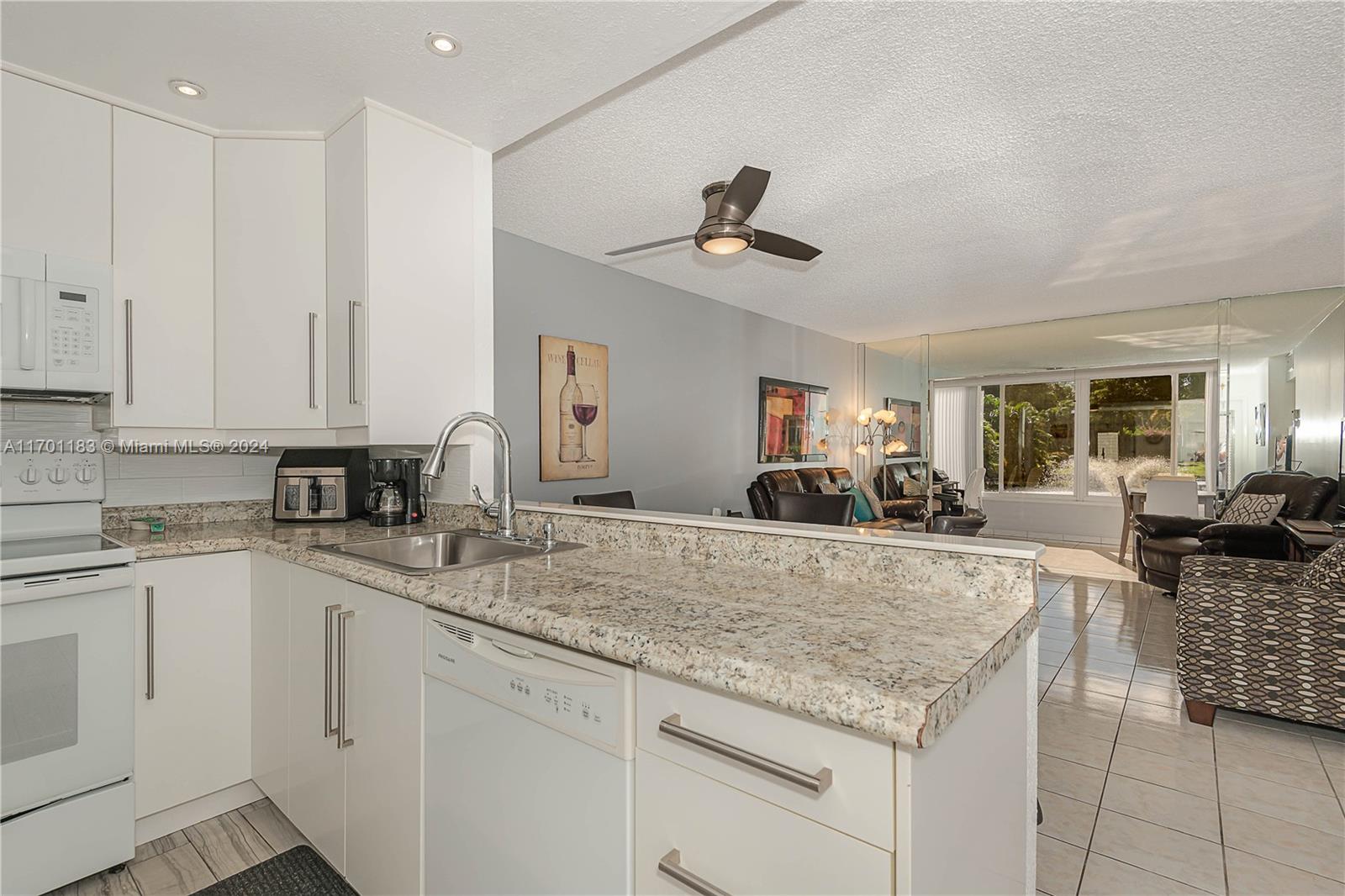 a view of living room with granite countertop furniture and fireplace