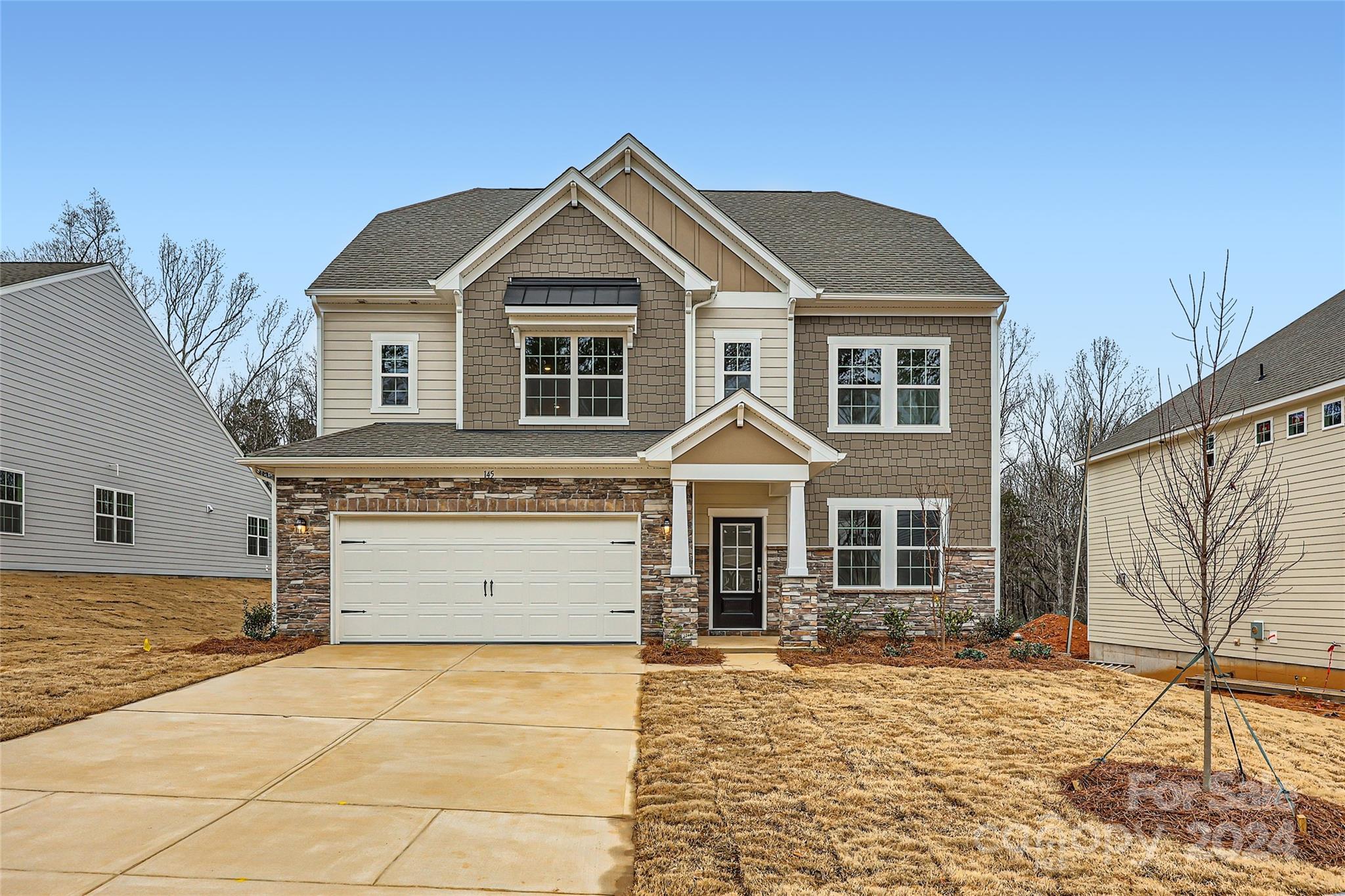 a front view of a house with a yard