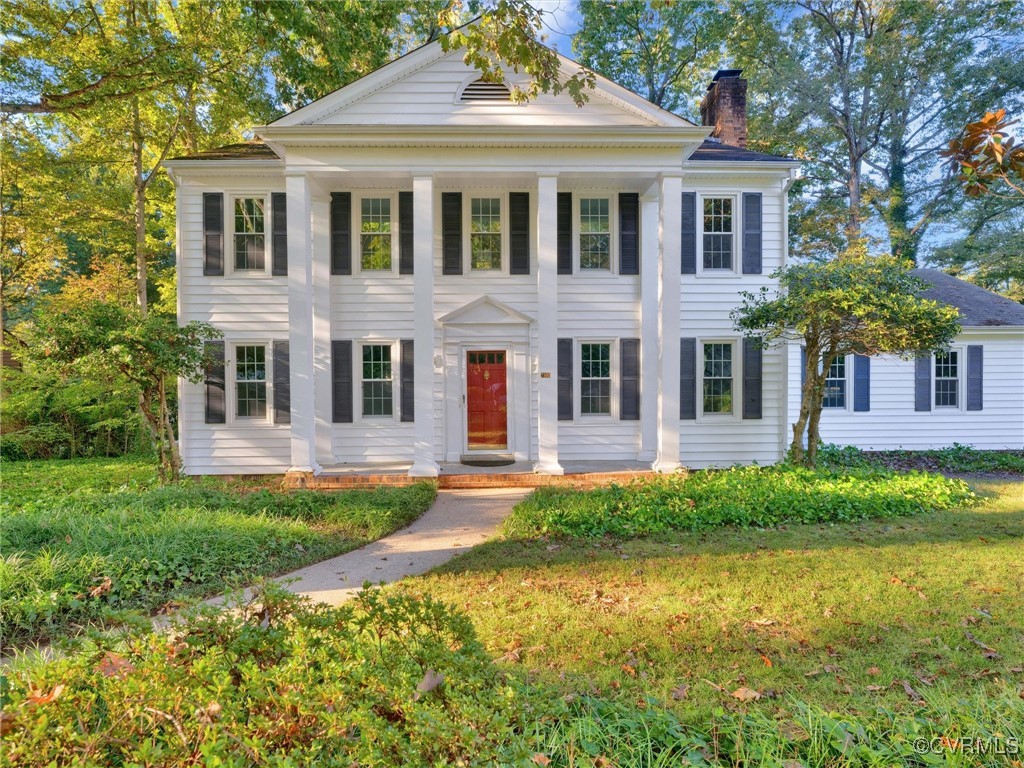 Greek revival house with a front yard