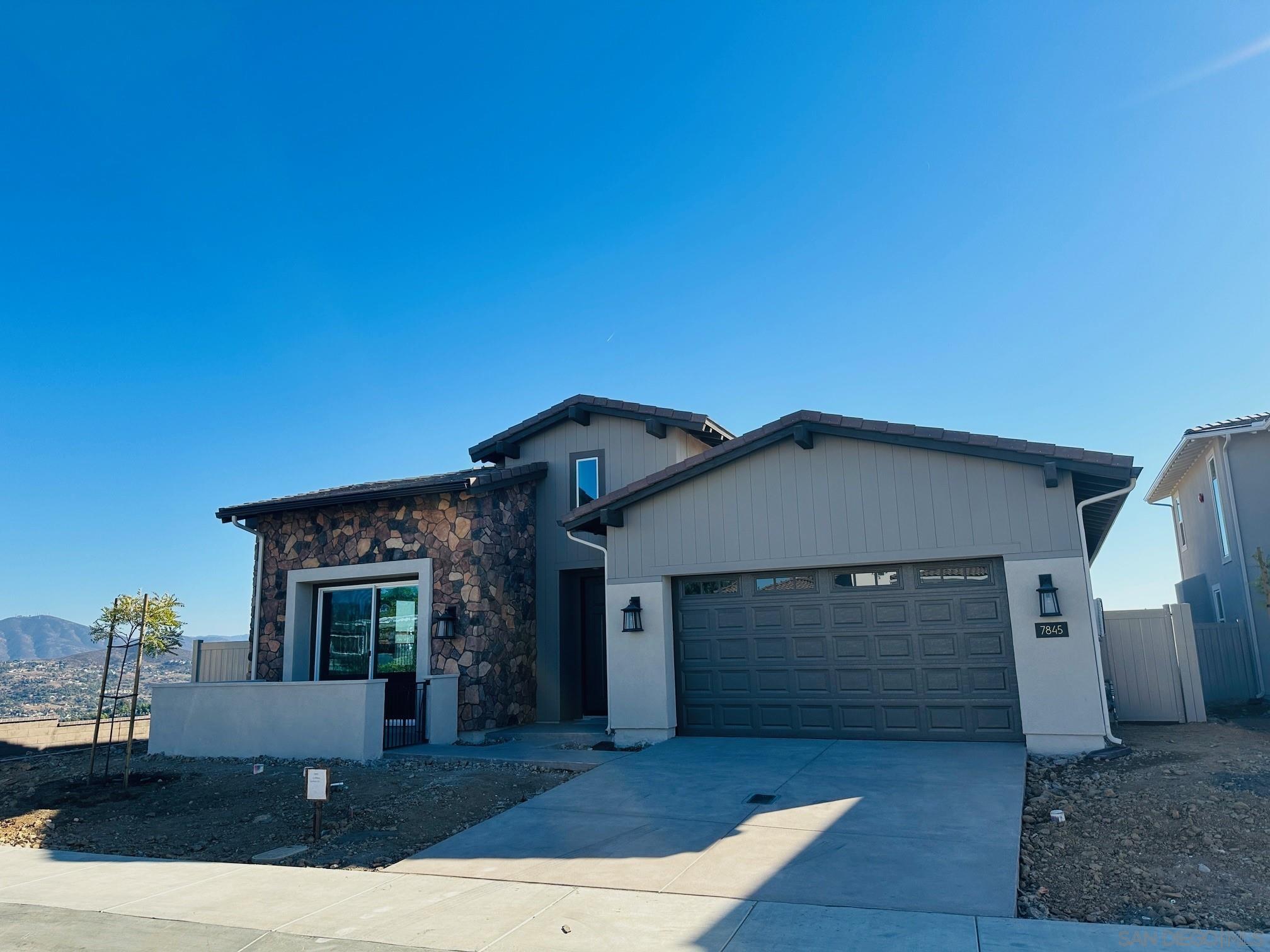 a front view of a house with garage