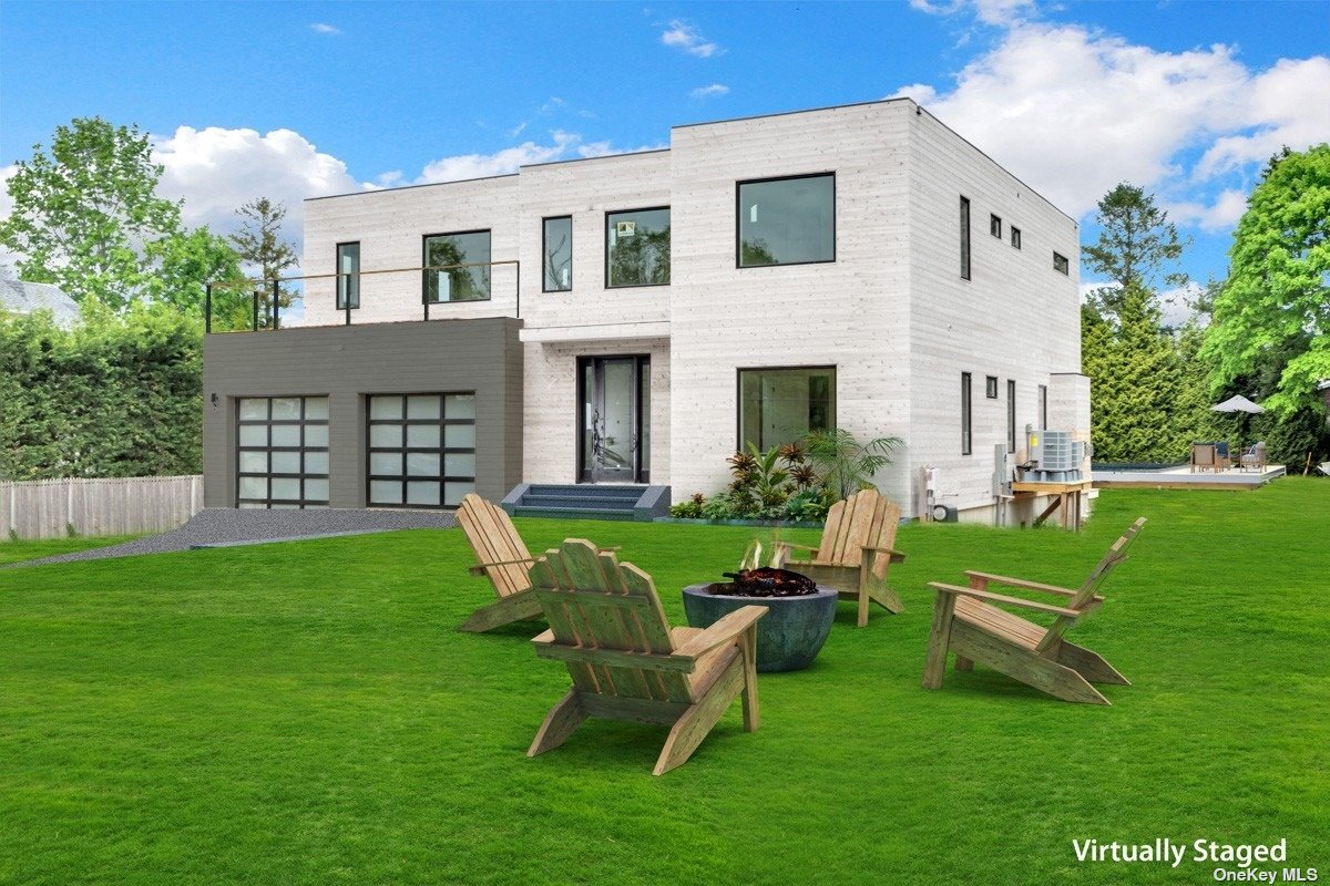 a view of a house with a backyard