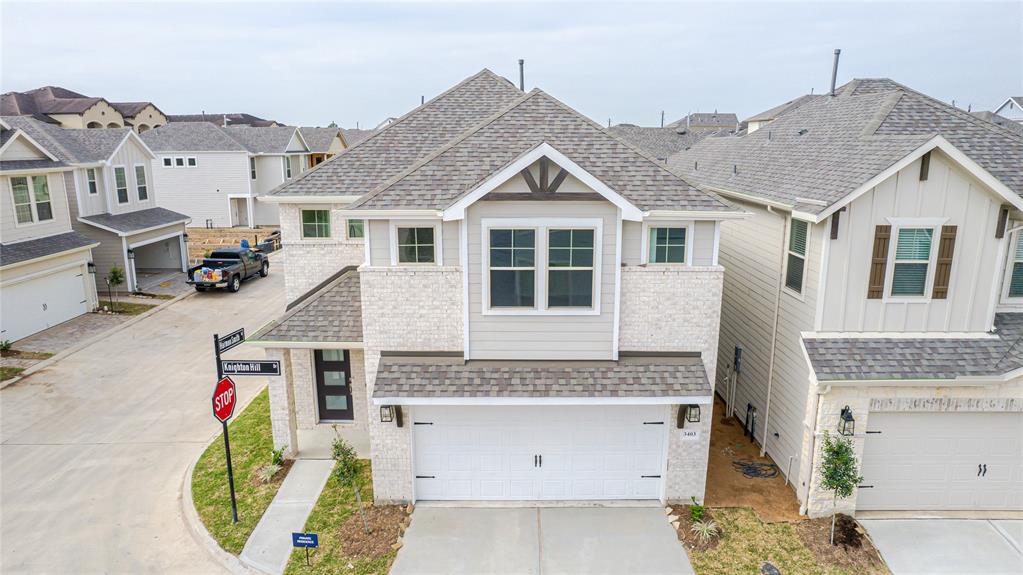 a aerial view of a house with a yard