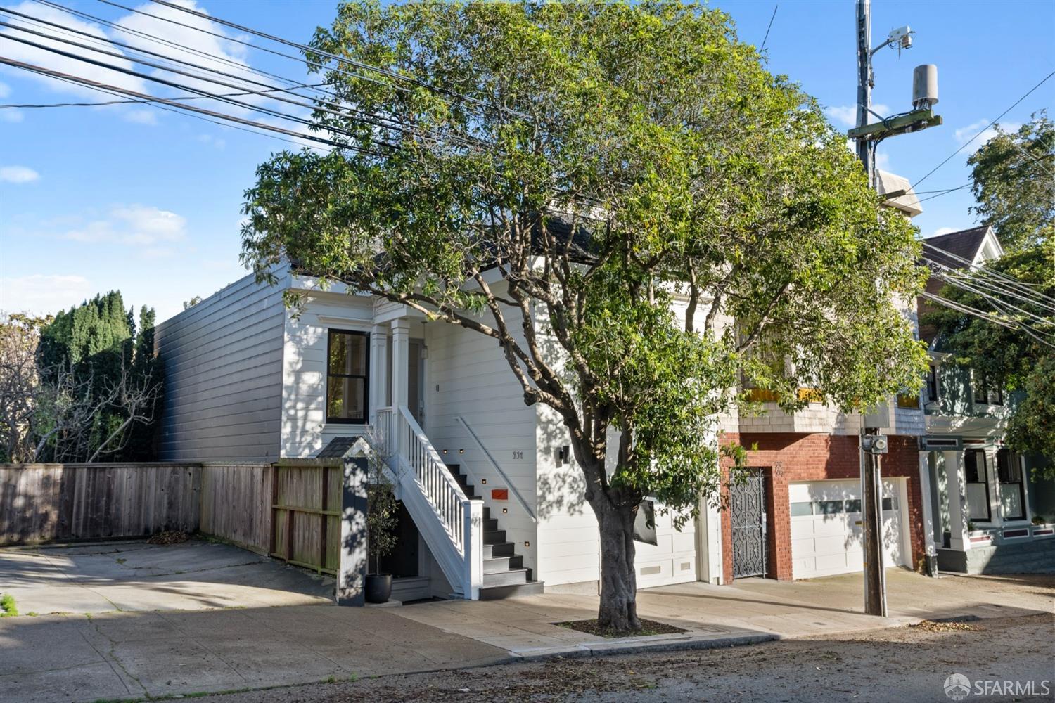 a view of a house next to a road and yard