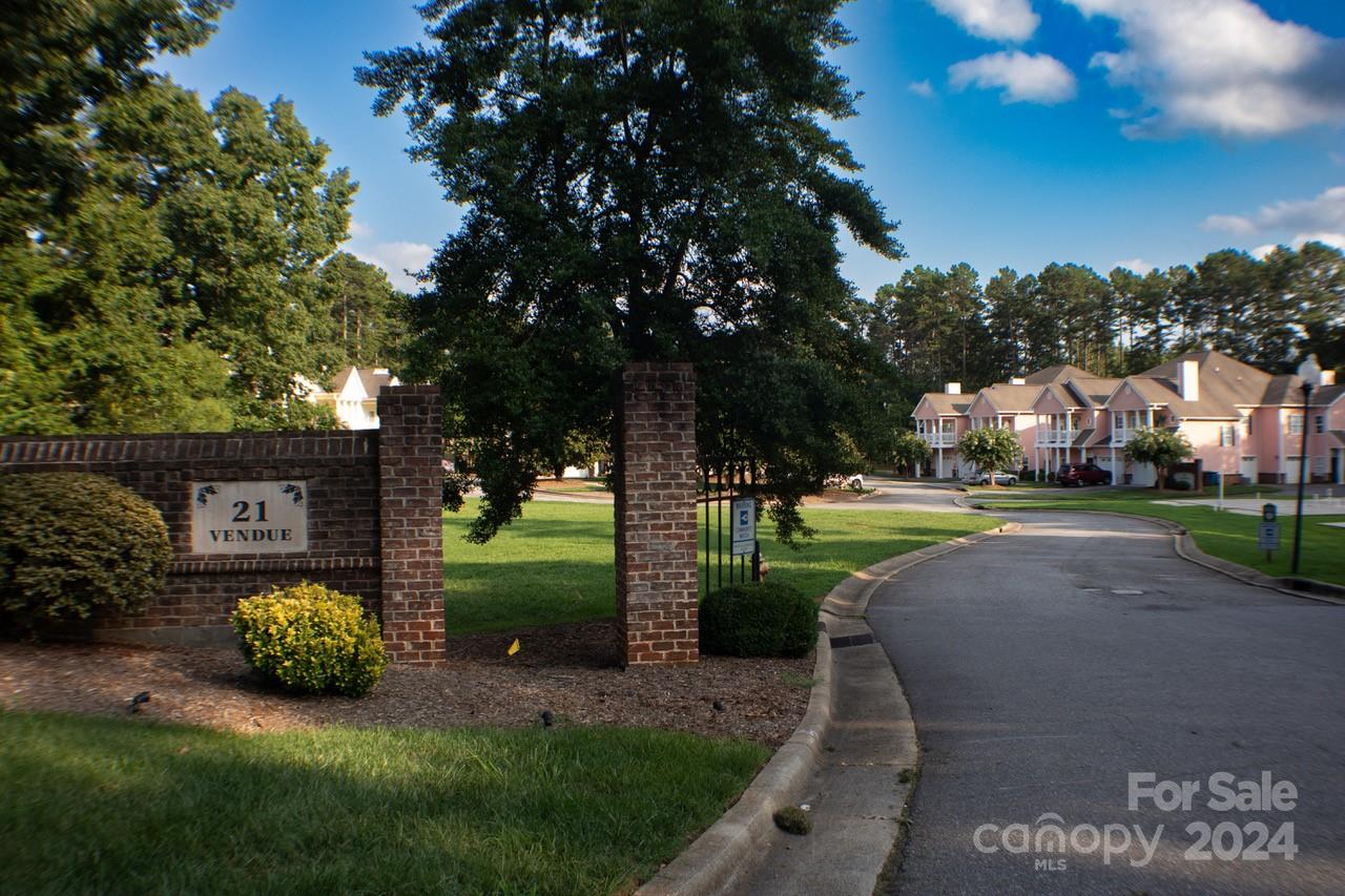 a view of a park with large trees